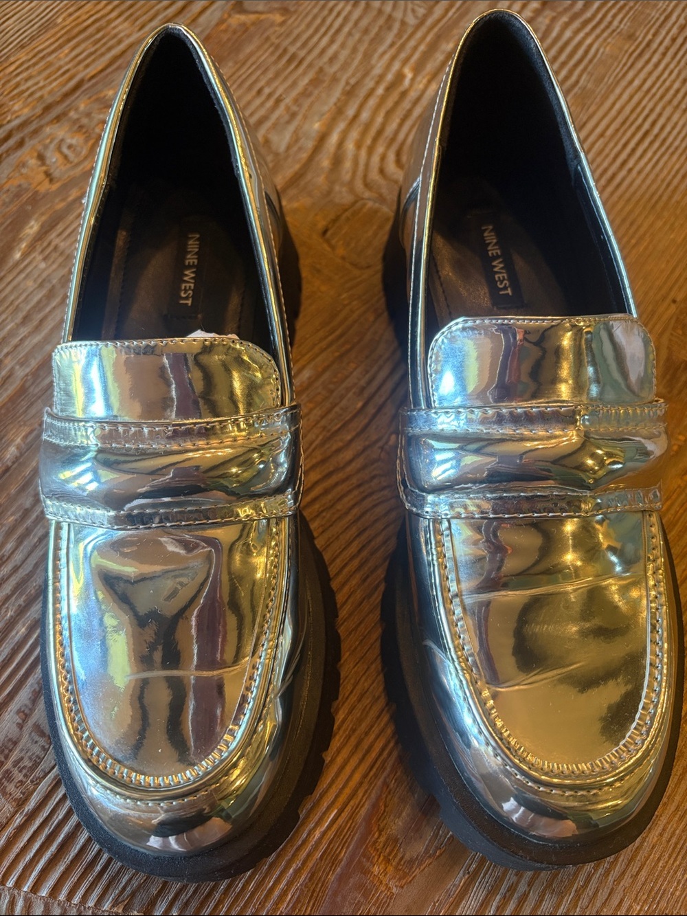 Nine West Womenโs Shiny Silver
Lug Sole Loafers